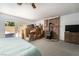 Bright basement featuring a wood-burning stove, fireplace, and a bed, with moving boxes at 18480 State Hwy 160, Las Vegas, NV 89161