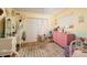bedroom with a swing, pink dresser and decor on a yellow and blue wall at 18480 State Hwy 160, Las Vegas, NV 89161