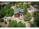 Stunning two-story cabin nestled in lush greenery with a cozy front deck and mountain views at 18480 State Hwy 160, Las Vegas, NV 89161