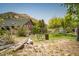 Charming home featuring a green roof and wooden exterior nestled in a scenic landscape with mountain views at 18480 State Hwy 160, Las Vegas, NV 89161