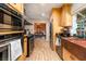 Gourmet kitchen featuring stainless appliances, wood cabinets, and a large copper sink at 18480 State Hwy 160, Las Vegas, NV 89161