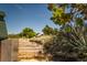 Rustic stone steps leading to a home nestled among native vegetation, offering privacy and scenic beauty at 18480 State Hwy 160, Las Vegas, NV 89161