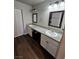 Spacious bathroom featuring dual sinks with granite countertops and modern fixtures at 1870 Upland Ave, Pahrump, NV 89048