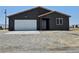 Inviting single-story home featuring a two car garage and low maintenance desert landscaping at 1870 Upland Ave, Pahrump, NV 89048