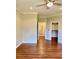 Spacious bedroom featuring hardwood floors, crown molding, a ceiling fan, and walk-in closet at 1941 Williamsport St, Henderson, NV 89052