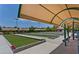 Outdoor bocce ball courts featuring shaded seating areas and meticulous artificial turf at 1941 Williamsport St, Henderson, NV 89052