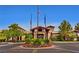 Community clubhouse entrance with well-maintained landscaping and flower beds at 1941 Williamsport St, Henderson, NV 89052