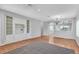 Open living room with built-in shelving, hardwood floors, and views into the dining and kitchen areas at 1941 Williamsport St, Henderson, NV 89052