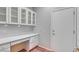 Functional office space featuring built-in cabinets, a long desk, and hardwood flooring at 1941 Williamsport St, Henderson, NV 89052