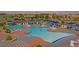 Community pool area featuring multiple pools, lounge chairs, tables, and scenic views of the surrounding neighborhood at 1941 Williamsport St, Henderson, NV 89052
