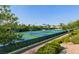 Aerial view of well-maintained tennis courts surrounded by lush landscaping at 1941 Williamsport St, Henderson, NV 89052