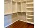 A spacious walk-in closet provides ample storage with built-in shelving and hanging rods at 1941 Williamsport St, Henderson, NV 89052