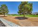 Backyard view showcasing a golf course and lush greenery in the distance at 1950 Abarth St, Las Vegas, NV 89142