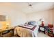 A cozy bedroom featuring a bed with patterned coverings, and side tables at 1950 Abarth St, Las Vegas, NV 89142