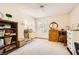 The bedroom features a neutral carpet, bright window, and vintage furnishings at 1950 Abarth St, Las Vegas, NV 89142