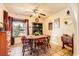 Cozy dining area features a rustic wood table set and vintage decor, creating a warm and inviting atmosphere for meals at 1950 Abarth St, Las Vegas, NV 89142
