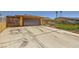 Spacious driveway leading to an attached garage, complemented by xeriscaped front yard at 1950 Abarth St, Las Vegas, NV 89142
