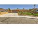 Lovely single-story home with a spacious driveway, attached garage and desert landscaping at 1950 Abarth St, Las Vegas, NV 89142