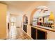 Hallway with arched ceilings and view into a living area at 1950 Abarth St, Las Vegas, NV 89142