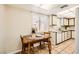 Bright kitchen nook with a wooden table and chairs, complemented by plenty of natural light from the adjacent window at 1950 Abarth St, Las Vegas, NV 89142