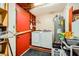 A convenient laundry room with washer, dryer, and water heater at 1950 Abarth St, Las Vegas, NV 89142