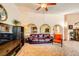 Open-concept living area with high ceilings, comfortable seating, and an inviting atmosphere at 1950 Abarth St, Las Vegas, NV 89142
