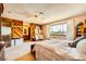 The main bedroom shows a bright window and wood paneling detail at 1950 Abarth St, Las Vegas, NV 89142