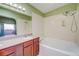 Bathroom with tub and double shower head, plus vanity at 2212 Sunfish Dr # C, Henderson, NV 89014