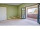 Bright bedroom featuring neutral carpet and balcony entrance at 2212 Sunfish Dr # C, Henderson, NV 89014