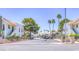 View of condos featuring mature trees, lush landscaping and ample parking at 2212 Sunfish Dr # C, Henderson, NV 89014