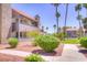 Exterior view of property with lush landscaping, mature trees, and well-maintained grounds at 2212 Sunfish Dr # C, Henderson, NV 89014