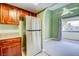 View of Kitchen flowing into living room, featuring stainless steel refrigerator and archway at 2212 Sunfish Dr # C, Henderson, NV 89014
