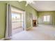Spacious living room featuring a fireplace and sliding glass doors leading to a balcony at 2212 Sunfish Dr # C, Henderson, NV 89014