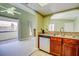 Living room featuring kitchen view, balcony access, fireplace, and lots of natural light at 2212 Sunfish Dr # C, Henderson, NV 89014
