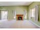 Spacious living room featuring a cozy fireplace and plenty of natural light at 2212 Sunfish Dr # C, Henderson, NV 89014