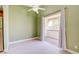 Bright living room with ceiling fan and sliding glass door to the patio at 2212 Sunfish Dr # C, Henderson, NV 89014