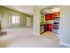 View of living room flowing into kitchen with stainless steel appliances and dark wood cabinets at 2212 Sunfish Dr # C, Henderson, NV 89014