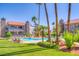 Inviting community pool area with green lawn and mature trees at 2212 Sunfish Dr # C, Henderson, NV 89014