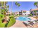 Relaxing pool with lounge chairs and lush landscaping, perfect for enjoying sunny days at 2212 Sunfish Dr # C, Henderson, NV 89014