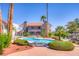 Serene community pool featuring lounge chairs and mature trees at 2212 Sunfish Dr # C, Henderson, NV 89014