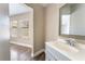 Bathroom featuring a vanity with mirror and a tiled shower, with view to another room at 2301 Maverick St, Las Vegas, NV 89108