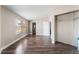 Spacious bedroom featuring wood-look flooring, windows, and a closet with shelving at 2301 Maverick St, Las Vegas, NV 89108