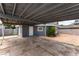 View of the house, carport, and backyard featuring dirt and gravel at 2301 Maverick St, Las Vegas, NV 89108