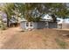 View of a charming home with a combination of rock landscaping and mature trees at 2301 Maverick St, Las Vegas, NV 89108
