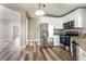 Open-concept kitchen with stainless steel appliances and seamless transitions to the living room at 2301 Maverick St, Las Vegas, NV 89108
