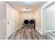 Laundry room with new appliances, white door and light wood flooring at 2301 Maverick St, Las Vegas, NV 89108