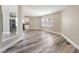 Bright living room with modern flooring flowing into an open-concept kitchen at 2301 Maverick St, Las Vegas, NV 89108