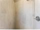 Close-up of a shower stall with white tiling and a modern shower head fixture at 2301 Maverick St, Las Vegas, NV 89108