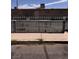 View of the home's gated backyard and building elevation at 2604 Webster St, North Las Vegas, NV 89030