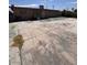 Wide backyard featuring a concrete surface and building elevation at 2604 Webster St, North Las Vegas, NV 89030